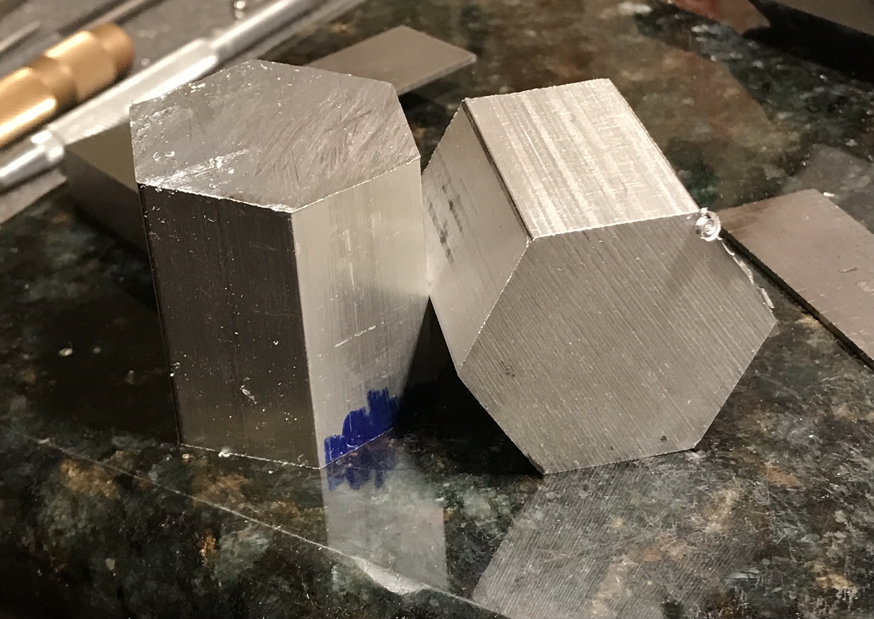 Two parts cut from aluminum hex